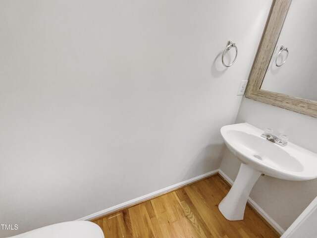105 Crosswaite Way, Cary, NC 27518 - half bath with baseboards, wood finished floors, and toilet