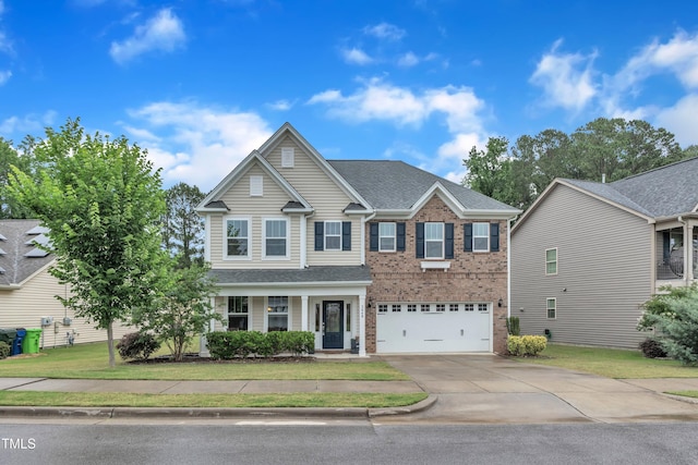3449 S Beaver Ln, Raleigh, NC 27604 - view of front of property featuring driveway, brick siding, an attached garage, and a front yard