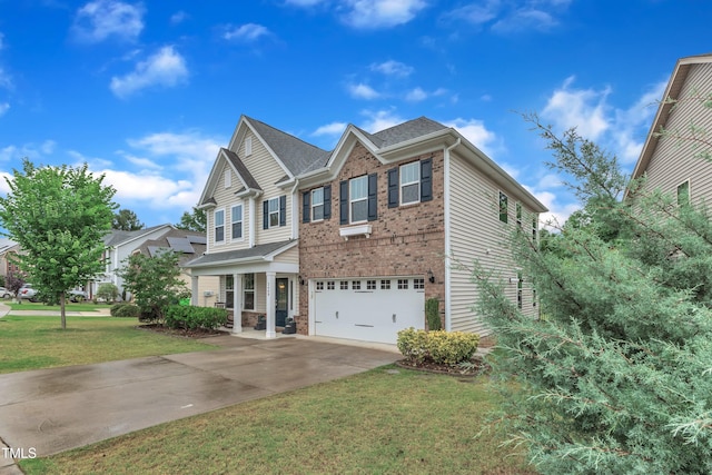 3449 S Beaver Ln, Raleigh, NC 27604 - view of front of house with driveway, brick siding, a garage, a front lawn, and covered porch