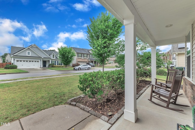 3449 S Beaver Ln, Raleigh, NC 27604 - porch with a residential view, a yard, and driveway