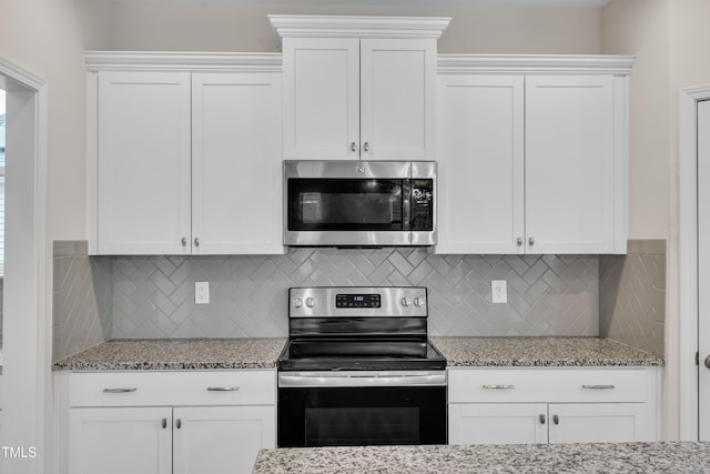 3449 S Beaver Ln, Raleigh, NC 27604 - kitchen with stainless steel appliances, light stone counters, decorative backsplash, and white cabinetry