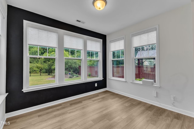 3449 S Beaver Ln, Raleigh, NC 27604 - empty room featuring healthy amount of natural light, light wood finished floors, and baseboards