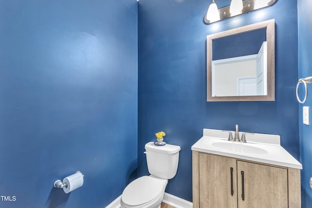 3449 S Beaver Ln, Raleigh, NC 27604 - bathroom with toilet, vanity, and baseboards