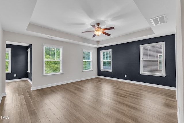 3449 S Beaver Ln, Raleigh, NC 27604 - empty room featuring a raised ceiling, a ceiling fan, baseboards, and wood finished floors