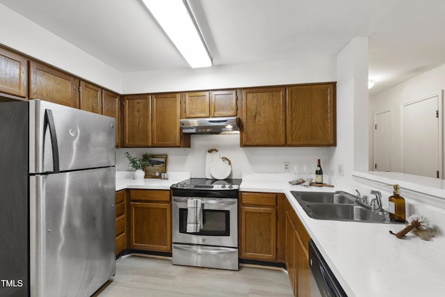 407 Gooseneck Dr Unit B1, Cary, NC 27513 - kitchen with stainless steel appliances, under cabinet range hood, light wood-style flooring, and light countertops