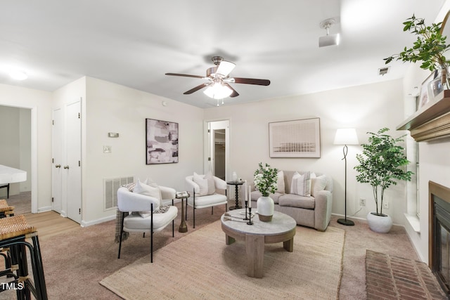 407 Gooseneck Dr Unit B1, Cary, NC 27513 - carpeted living room with a fireplace and ceiling fan