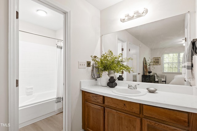 407 Gooseneck Dr Unit B1, Cary, NC 27513 - ensuite bathroom with vanity, shower / bath combo with shower curtain, and wood finished floors