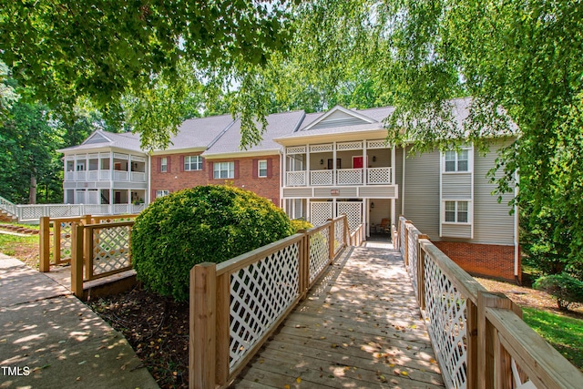 407 Gooseneck Dr Unit B1, Cary, NC 27513 - back of house featuring brick siding and a balcony