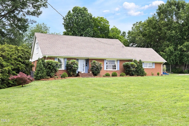 816 Miller Rd, Hillsborough, NC 27278 - view of front of property featuring brick siding, a front yard, and roof with shingles