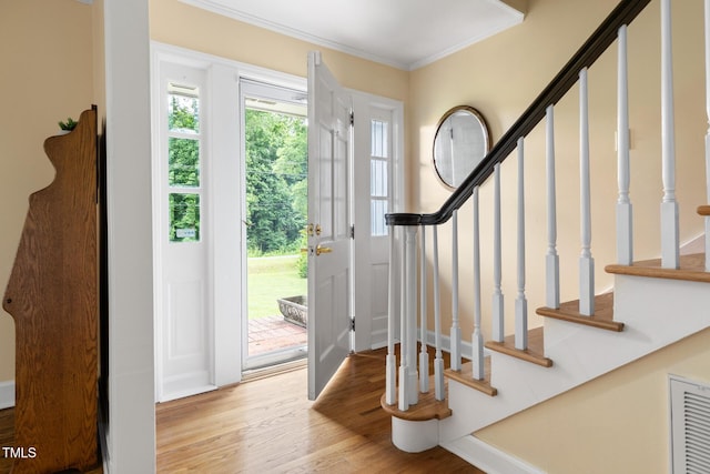 816 Miller Rd, Hillsborough, NC 27278 - foyer entrance with wood finished floors, crown molding, and stairway