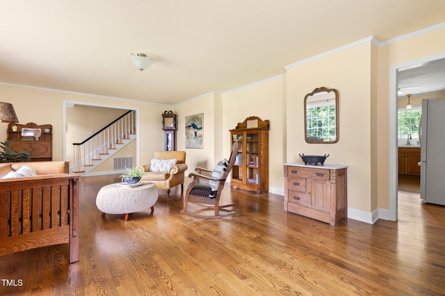 816 Miller Rd, Hillsborough, NC 27278 - living room with wood finished floors, stairway, ornamental molding, and baseboards
