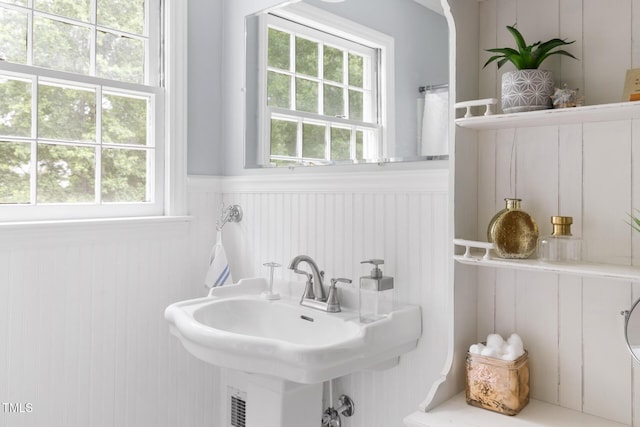 816 Miller Rd, Hillsborough, NC 27278 - bathroom featuring a wainscoted wall, plenty of natural light, a decorative wall, and a sink