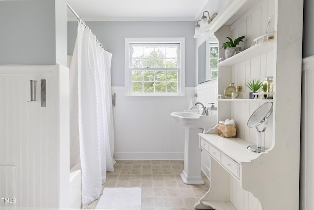 816 Miller Rd, Hillsborough, NC 27278 - bathroom featuring wainscoting, crown molding, shower / tub combo, a sink, and baseboards