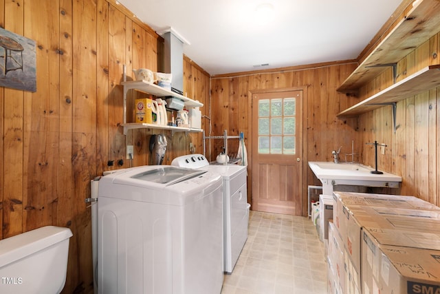 816 Miller Rd, Hillsborough, NC 27278 - laundry area with wooden walls, independent washer and dryer, and light flooring