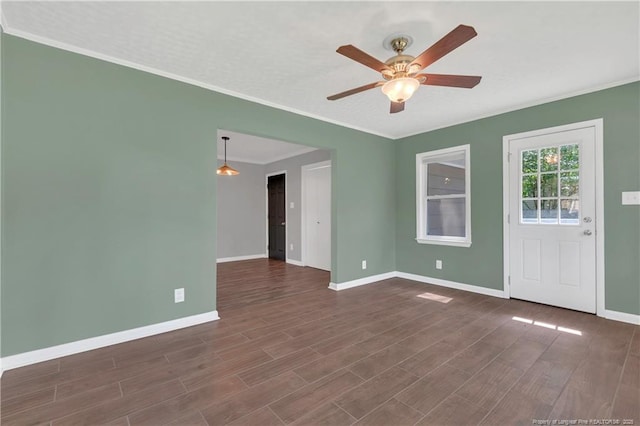 638 E Raynor Dr, Fayetteville, NC 28311 - unfurnished room with baseboards, ceiling fan, crown molding, and dark wood-style floors