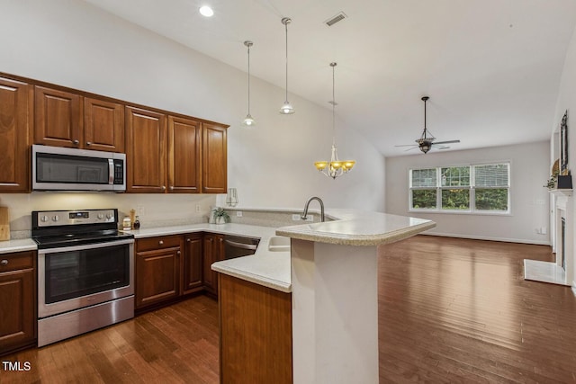 309 Plank Bridge Way, Morrisville, NC 27560 - kitchen featuring stainless steel appliances, a peninsula, ceiling fan, lofted ceiling, and dark wood-type flooring