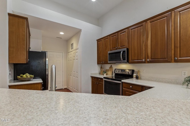 309 Plank Bridge Way, Morrisville, NC 27560 - kitchen featuring stainless steel appliances, light countertops, and recessed lighting