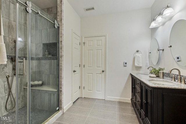 309 Plank Bridge Way, Morrisville, NC 27560 - full bath featuring double vanity, a shower stall, tile patterned flooring, and baseboards