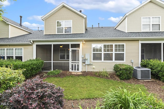 309 Plank Bridge Way, Morrisville, NC 27560 - back of house featuring central AC unit, a sunroom, roof with shingles, and a lawn
