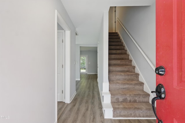 5408 Gunnette Dr, Raleigh, NC 27610 - stairway featuring wood finished floors and baseboards