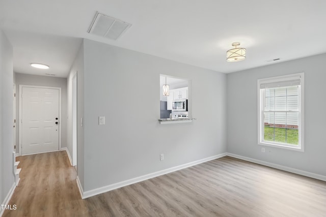 5408 Gunnette Dr, Raleigh, NC 27610 - spare room featuring wood finished floors and baseboards