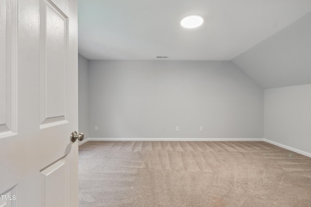 5408 Gunnette Dr, Raleigh, NC 27610 - bonus room with light colored carpet, lofted ceiling, and baseboards