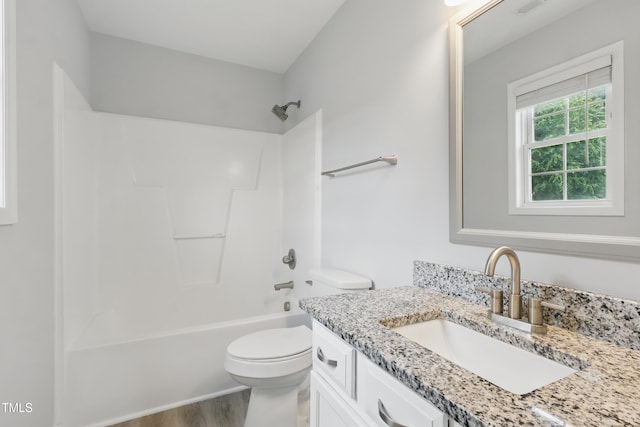 5408 Gunnette Dr, Raleigh, NC 27610 - full bath with vanity, toilet, wood finished floors, and bathing tub / shower combination