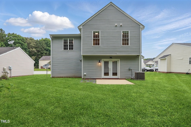 5408 Gunnette Dr, Raleigh, NC 27610 - back of house featuring central AC unit, a yard, french doors, and a patio area
