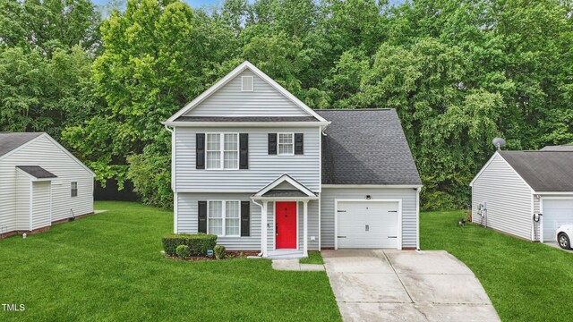 5408 Gunnette Dr, Raleigh, NC 27610 - view of front facade with driveway, a front yard, a garage, and roof with shingles