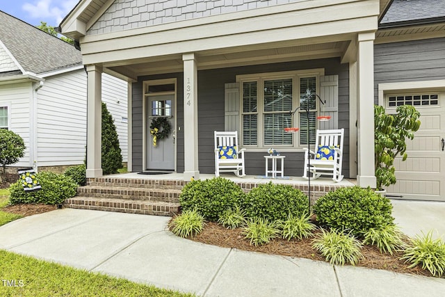 1374 Patriot Points Way, Fuquay Varina, NC 27526 - view of exterior entry with a porch, an attached garage, and a shingled roof