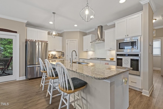 1374 Patriot Points Way, Fuquay Varina, NC 27526 - kitchen with appliances with stainless steel finishes, wall chimney range hood, a sink, plenty of natural light, and crown molding