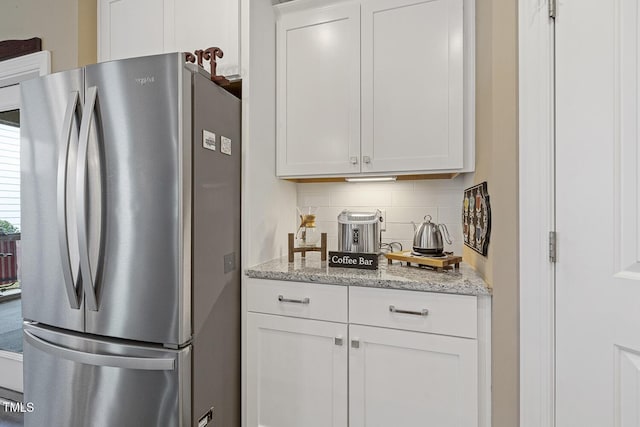 1374 Patriot Points Way, Fuquay Varina, NC 27526 - kitchen with freestanding refrigerator, backsplash, and white cabinetry