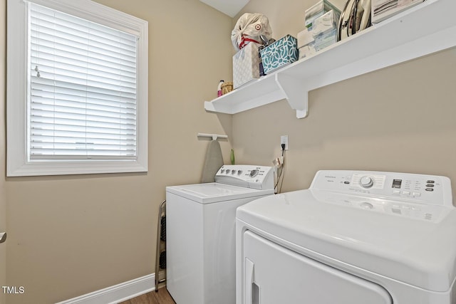1374 Patriot Points Way, Fuquay Varina, NC 27526 - washroom with washer and dryer, baseboards, and wood finished floors