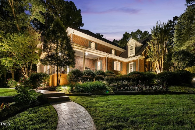 4021 Chaumont Dr, Apex, NC 27539 - view of front of home with a front yard and brick siding