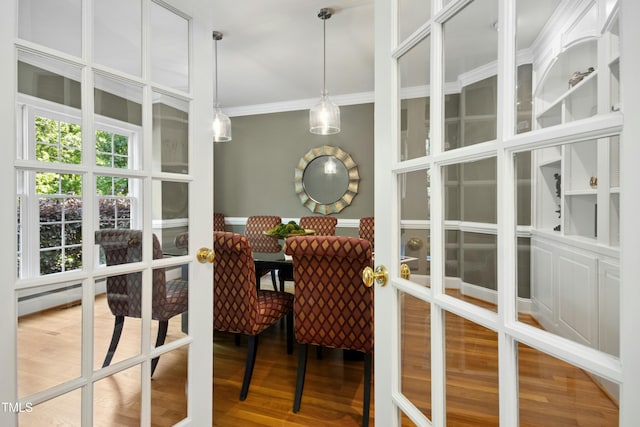 4021 Chaumont Dr, Apex, NC 27539 - dining room featuring french doors, wood finished floors, and crown molding
