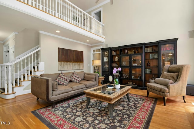 4021 Chaumont Dr, Apex, NC 27539 - living room with a towering ceiling, crown molding, stairway, wood finished floors, and recessed lighting