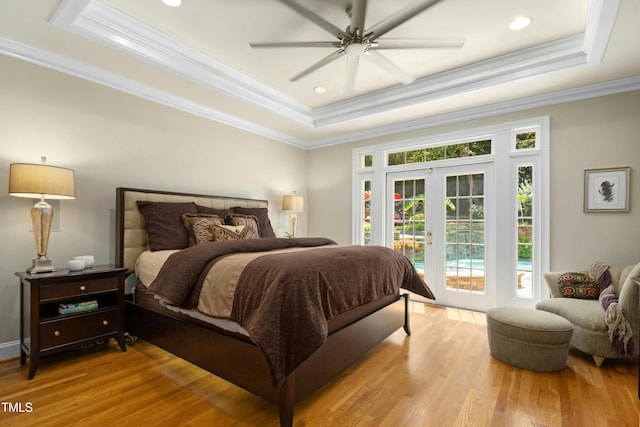 4021 Chaumont Dr, Apex, NC 27539 - bedroom featuring a raised ceiling, access to exterior, crown molding, wood finished floors, and ceiling fan