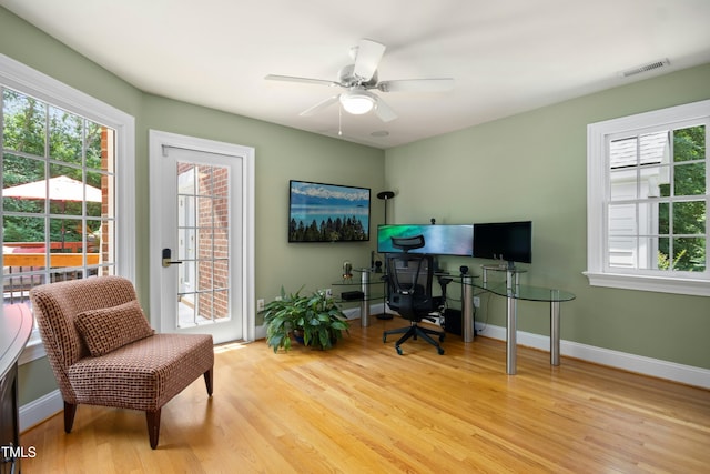 4021 Chaumont Dr, Apex, NC 27539 - home office with wood finished floors, healthy amount of natural light, ceiling fan, and baseboards