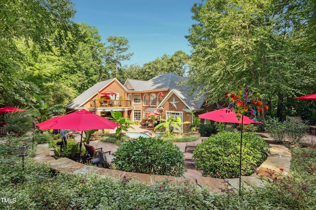 4021 Chaumont Dr, Apex, NC 27539 - back of house with a patio, brick siding, and a balcony