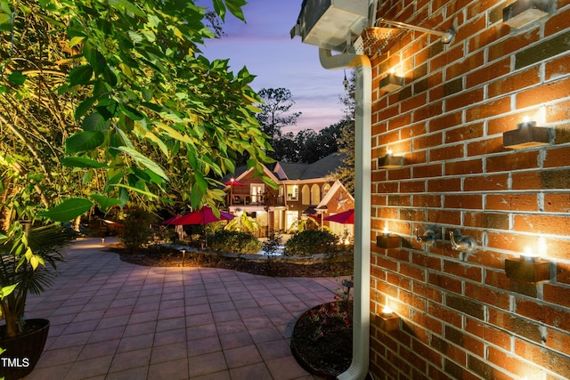 4021 Chaumont Dr, Apex, NC 27539 - patio terrace at dusk featuring a patio area