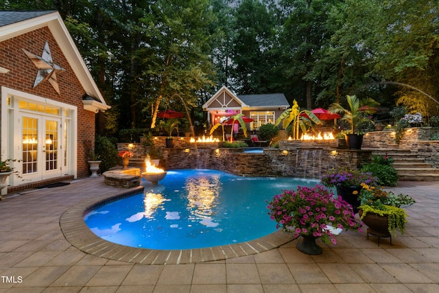 4021 Chaumont Dr, Apex, NC 27539 - outdoor pool with a fire pit, french doors, a hot tub, and a patio area