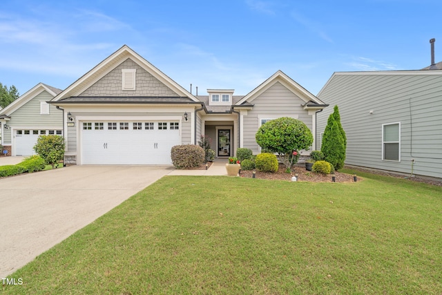 104 Spindle Dr, Durham, NC 27703 - view of front of home featuring an attached garage, driveway, and a front lawn