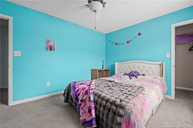 332 Dundee Cir, Raeford, NC 28376 - bedroom featuring carpet floors, baseboards, ceiling fan, a walk in closet, and a closet