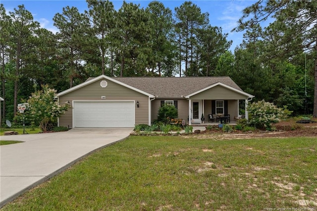 345 Pickett Cir, Vass, NC 28394 - single story home featuring a porch, an attached garage, concrete driveway, and a front lawn