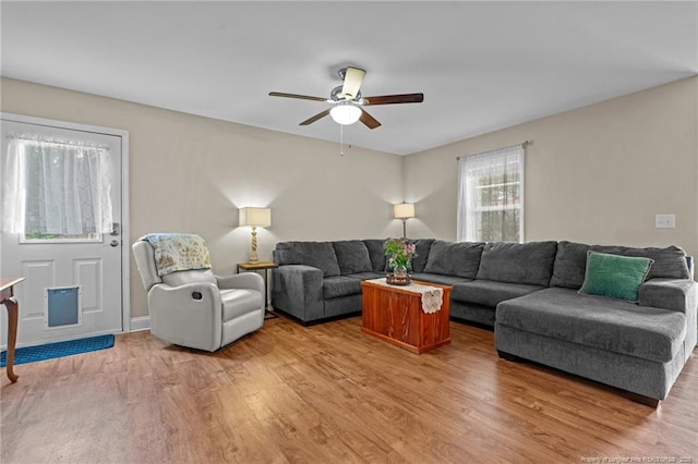 345 Pickett Cir, Vass, NC 28394 - living room featuring a ceiling fan and light wood-style floors