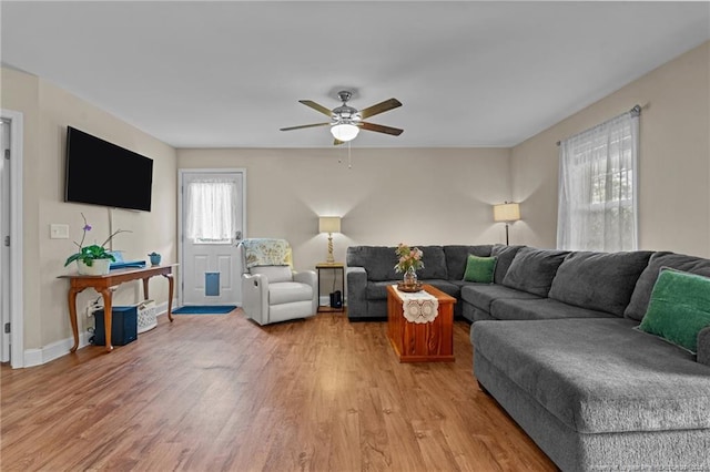 345 Pickett Cir, Vass, NC 28394 - living room with light wood-type flooring, ceiling fan, and baseboards
