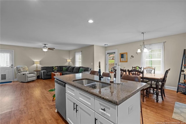 345 Pickett Cir, Vass, NC 28394 - kitchen featuring a sink, stainless steel dishwasher, healthy amount of natural light, dark stone counters, and recessed lighting