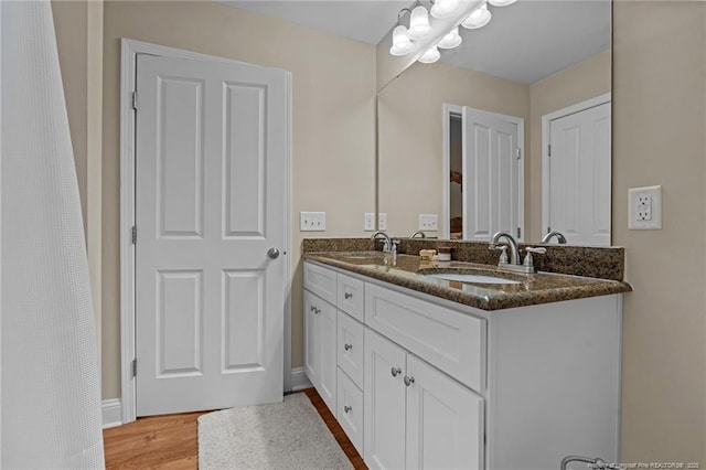 345 Pickett Cir, Vass, NC 28394 - full bathroom featuring double vanity, wood finished floors, and baseboards