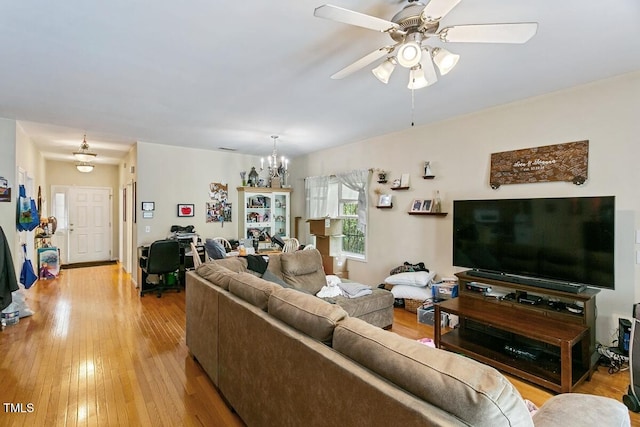 320 Madres Ln, Morrisville, NC 27560 - living room featuring light wood-type flooring, a chandelier, and a ceiling fan