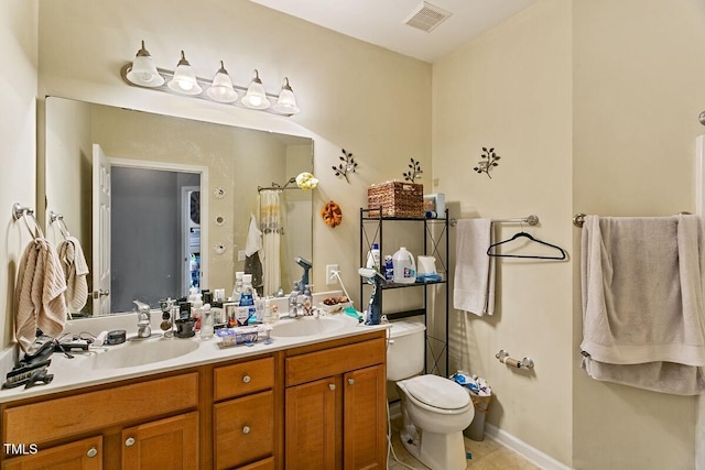 320 Madres Ln, Morrisville, NC 27560 - bathroom with toilet, double vanity, and tile patterned floors